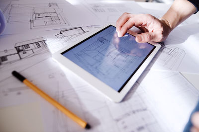 Architect using digital tablet