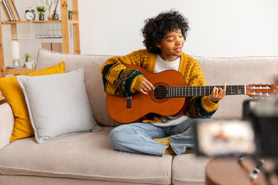 Young woman playing guitar