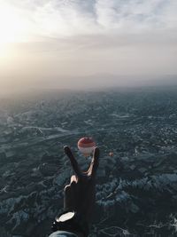 Rear view of man on landscape against sky