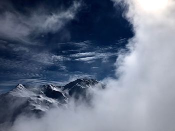 Scenic view of snowcapped mountains against sky