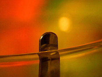 Close-up of glass bottle on table