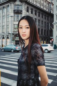 Portrait of woman standing in park