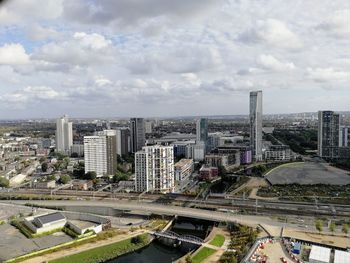 High angle view of buildings in city against sky