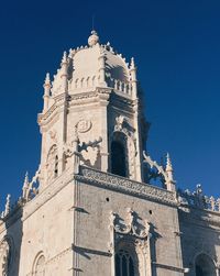 Low angle view of building against blue sky