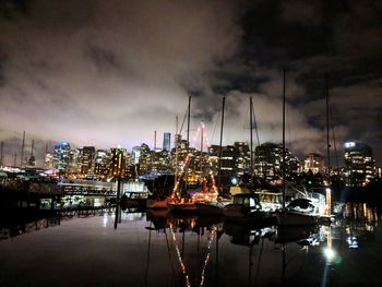 Sailboats in harbor at night