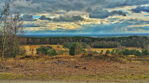 Scenic view of landscape against cloudy sky