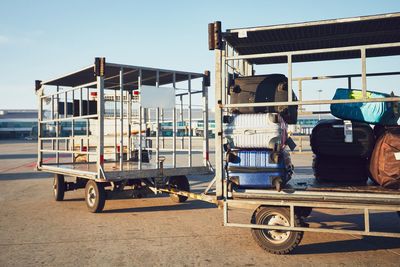 Vehicles loaded with luggage on runway