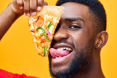 Close-up of man holding food