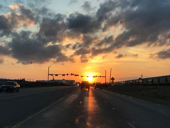 Road against sky at sunset