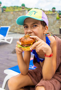 Portrait of woman holding food