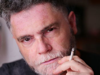 Close-up of man smoking cigarette