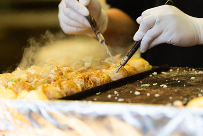 Close-up of person preparing food