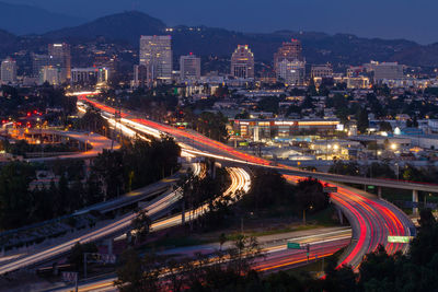 High angle view of light trails on road in city