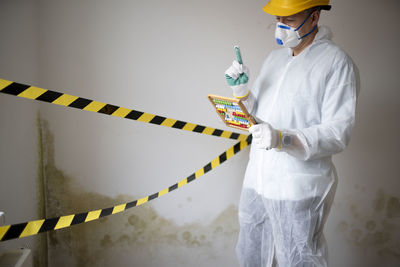 Side view of man working at construction site