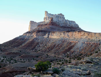 Low angle view of rock formation against clear sky