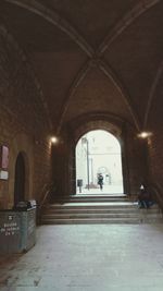 Woman walking in corridor