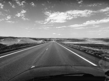 Road seen through car windshield