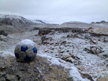Close-up of soccer ball on rock
