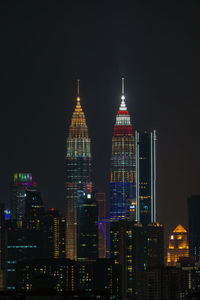Kuala lumpur's iconic petronas twin towers became a luminous emblem of international amity. 