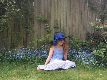 Full length of girl relaxing on grass