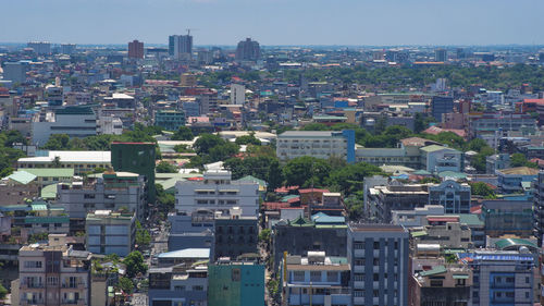 High angle view of buildings in city against clear sky