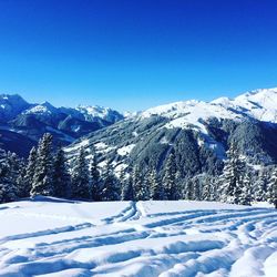 Snowcapped mountains against blue sky