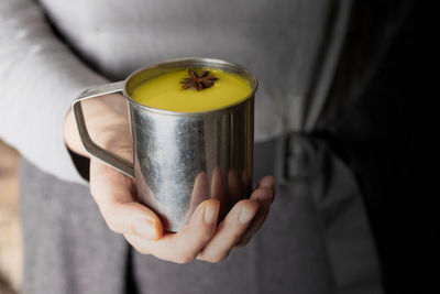Close-up of hand holding drink