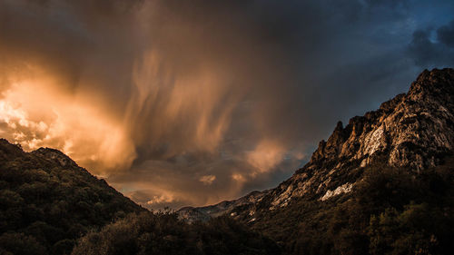 Low angle view of mountain against sky during sunset