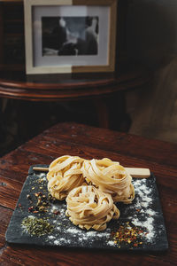 Delicious fresh italian pasta, fettuccini with spices.