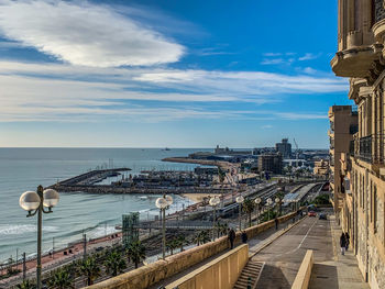 High angle view of road by sea against sky