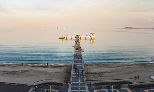 High angle view of sea against sky at sunset