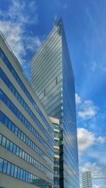 Low angle view of building against cloudy sky