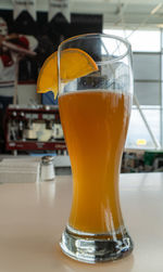 Close-up of beer glass on table