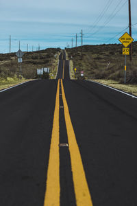 Surface level of empty road against sky