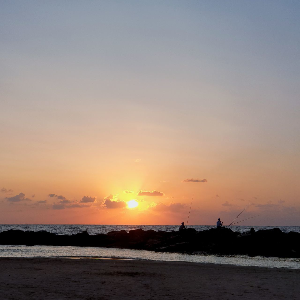 SCENIC VIEW OF SEA AGAINST ORANGE SKY