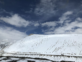 Scenic view of snow covered mountain against sky