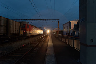 Train at railroad station against sky