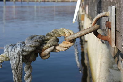 Close-up of rope tied on wooden post