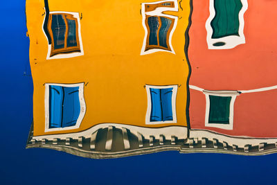Low angle view of built structure against blue sky