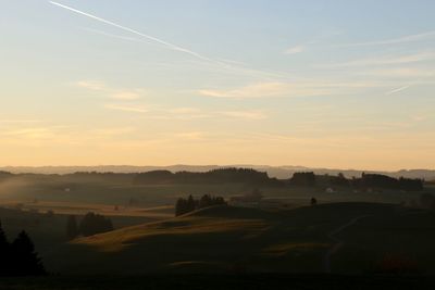 Scenic view of landscape at sunset