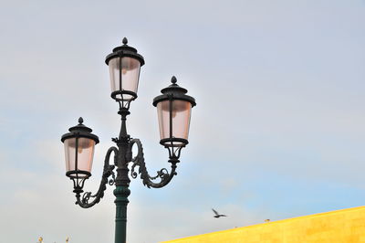 Low angle view of street light against clear sky