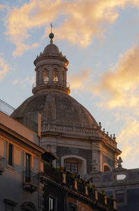 Low angle view of building against sky during sunset