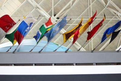 Low angle view of colorful umbrellas hanging in row