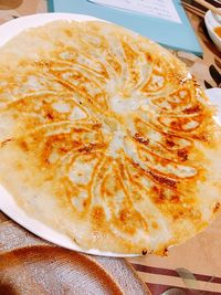 High angle view of pizza in plate on table