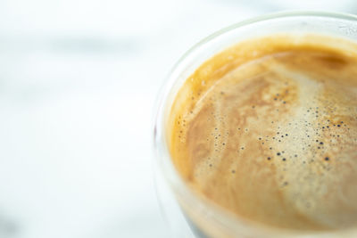 Close-up of coffee cup on table