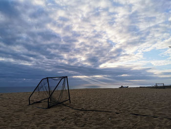 Scenic view of beach against sky during sunset