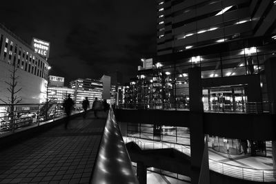 Illuminated buildings in city at night