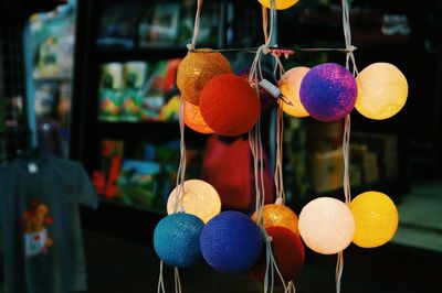 Close-up of multi colored decorations hanging at market stall