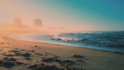 Scenic view of beach against clear sky