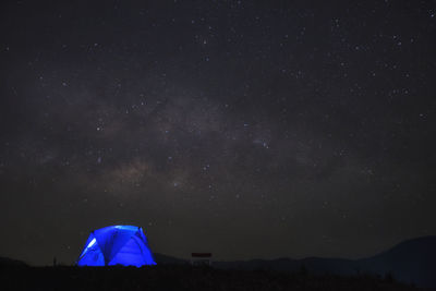Tent against star field at night